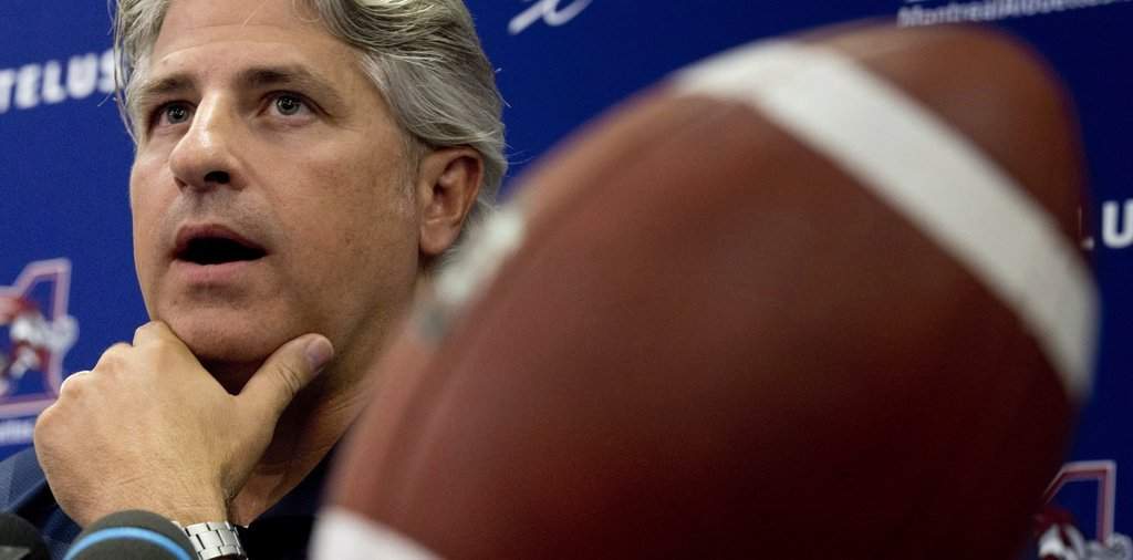 Montreal Alouettes general manager Jim Popp comments on the firing of head coach Dan Hawkins Thursday, August 1, 2013 in Montreal. Popp will take over as interim coach. THE CANADIAN PRESS/Paul Chiasson.