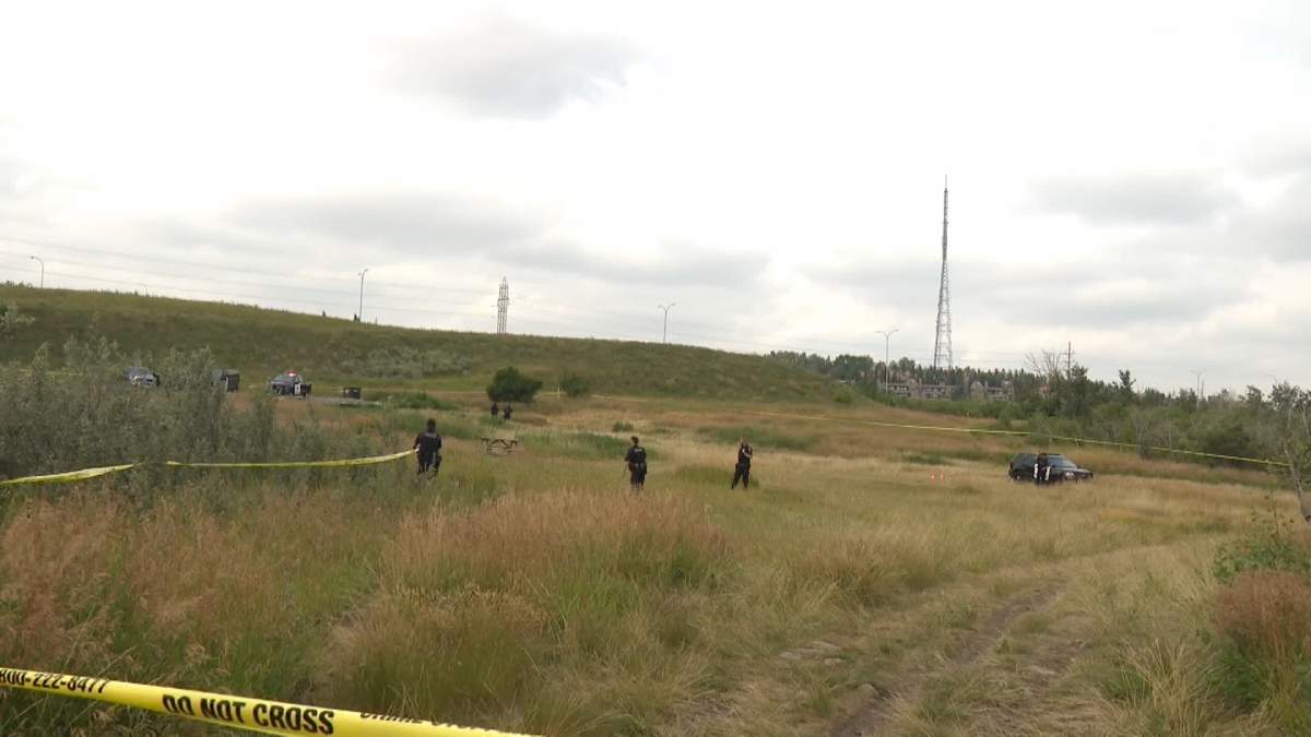 Calgary police had a large area of Edworthy Park, in the city's southwest, taped off Friday afternoon as they continued to search for evidence following the shooting of an officer during a nearby traffic stop.