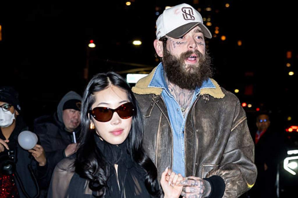 Post Malone and Christy Lee attend Khaite fashion show during New York Fashion Week at Park Avenue Armory on February 14, 2026 in New York City.
