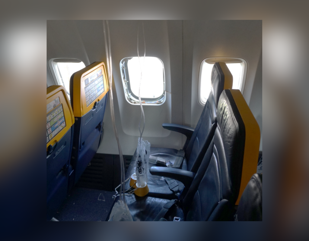 View of the row 11 passenger cabin window from the interior, right side of the cabin.