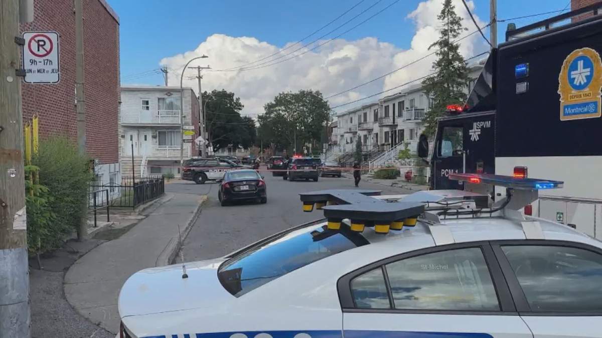Members of the SPVM sit outside an apartment on 39th Street in the Villeray–Saint-Michel–Parc-Extension borough after a homicide was confirmed Aug. 17.