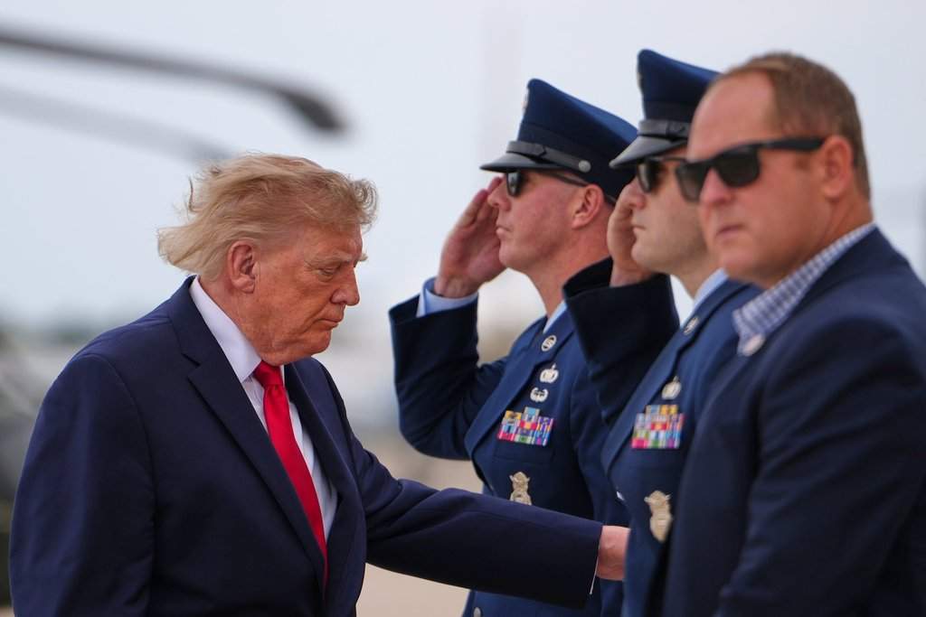President Donald Trump boards Air Force One, Saturday, Sept. 26, 2026, at Joint Base Andrews, Md. (AP Photo/Julia Demaree Nikhinson).