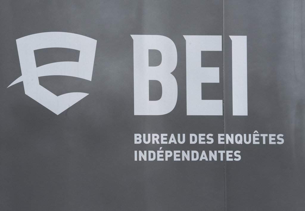 The logo of the BEI, Quebec’s independent police watchdog, is seen as investigators examine a scene in Louiseville, Que., Tuesday, March 28, 2023. T.