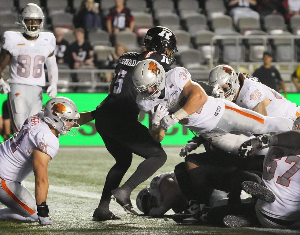 BC Lions running back Zander Horvath (34) scores a touchdown in second half CFL football action against the Ottawa Redblacks in Ottawa, Sunday, Aug. 30, 2026. THE CANADIAN PRESS/Chris Tanouye.