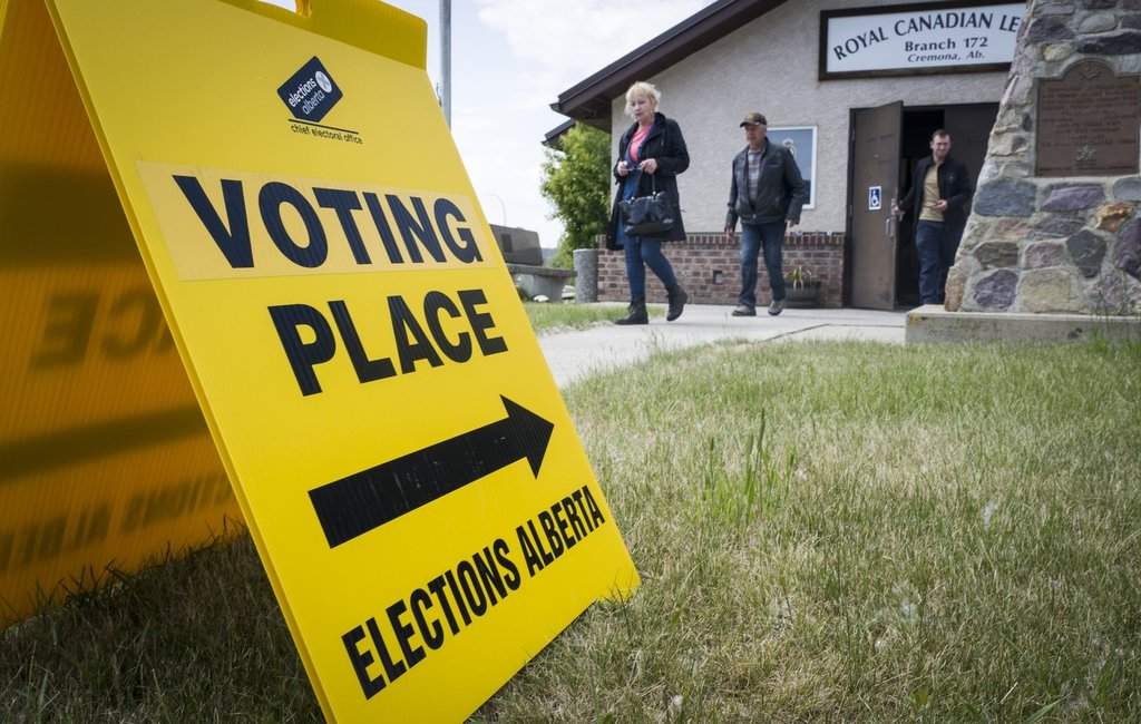 Voters leave a polling station after casting ballots in an Alberta byelection for the Olds-Didsbury-Three Hills riding, in Cremona, Alta., Monday, June 23, 2025. THE CANADIAN PRESS/Jeff McIntosh.