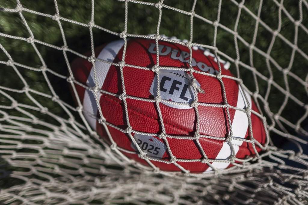 Canadian Football League logo on a football at opening day of CFL training camp in Guelph, Ont., on Sunday, May 11, 2025. The CFL has suspended B.C. Lions fullback Jacob Bond for two games for violating its drug policy on Sept. 2, 2026. THE CANADIAN PRESS/Nick Iwanyshyn.