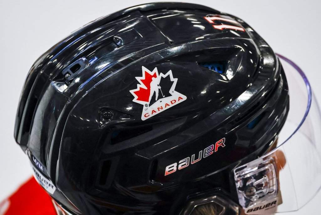 A Hockey Canada logo is visible on the helmet of a national junior team player during a training camp practice in Calgary, Tuesday, Aug. 2, 2022. Hockey Canada asked former NHL player and executive Brendan Shanahan to review junior hockey in Ontario. Shanahan delivered a report with 11 recommendations on Sept. 25, 2026. THE CANADIAN PRESS/Jeff McIntosh.