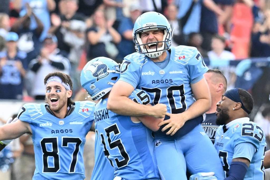 Toronto Argonauts kicker Lirim Hajrullahu (70) is hoisted by teammates after kicking the game-winning field goal against the Edmonton Elks during second half CFL football action in Toronto Saturday, Sept. 13, 2025. THE CANADIAN PRESS/Jon Blacker.