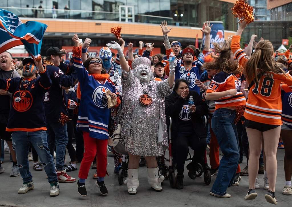 Oilers fans, including Mama Stanley, cheers as they watch the Edmonton Oilers score a goal against the Florida Panthers during a watch party for Game 5 of the NHL Stanley Cup final, in Edmonton on Tuesday, June 18, 2024.