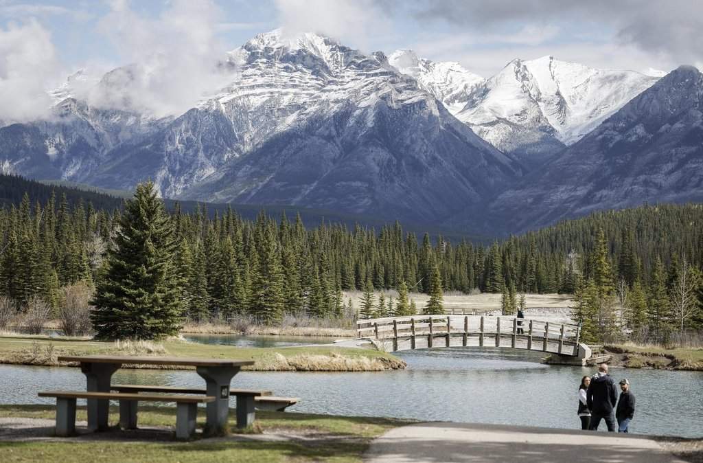 Visitors explore Cascade Ponds in Banff National Park, Alta., Thursday, May 15, 2025. 