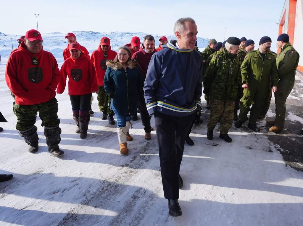 Prime Minister Mark Carney leaves a photo opportunity after making an announcement at a Canadian Armed Forces forward-operating location in Iqaluit, Nunavut, on Tuesday, March 18, 2025. THE CANADIAN PRESS/Sean Kilpatrick.