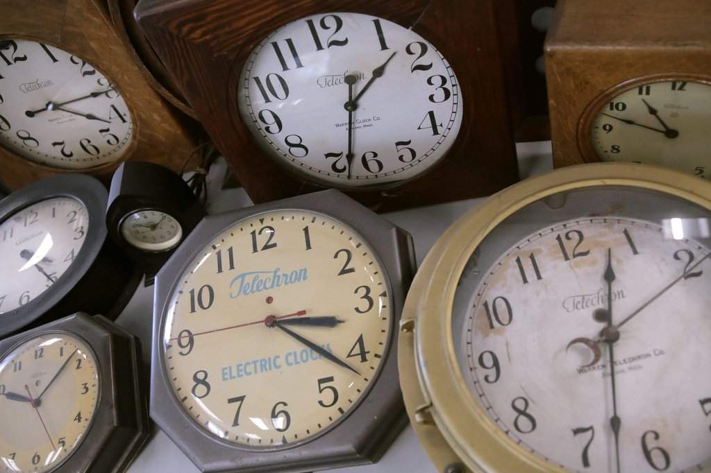In this Thursday, March 5, 2020, photo, antique clocks are displayed at the Electric Time Company, in Medfield, Mass. 