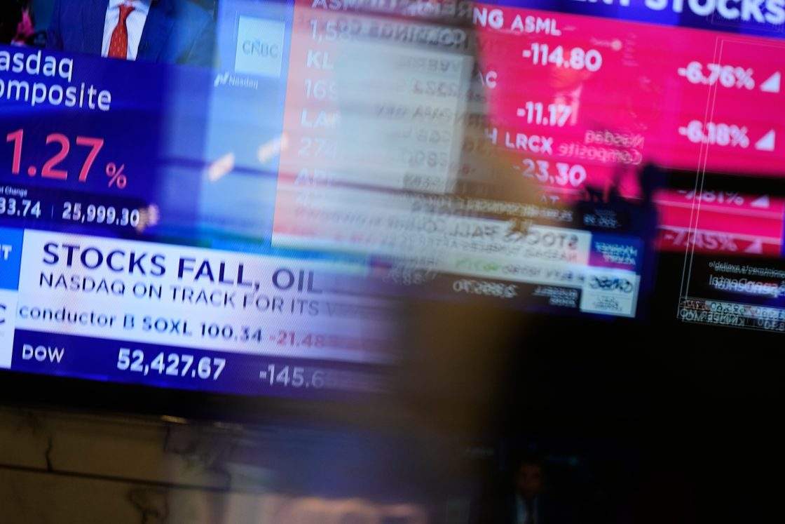 Electronic displays show financial news on the floor at the New York Stock Exchange in New York, Monday, Sept. 14, 2026.