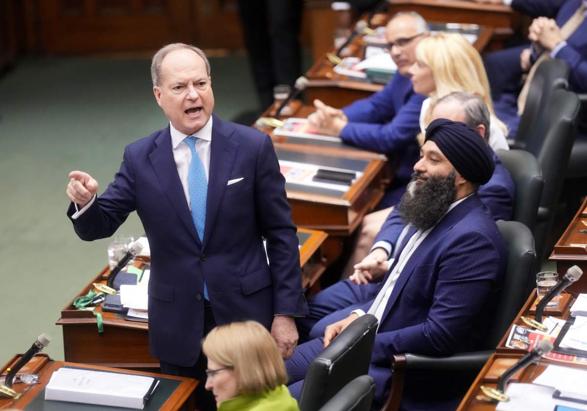 Finance Minister for Ontario Peter Bethlenfalvy, left, yells at the opposition during the last sitting day in the legislature before summer break at Queen's Park in Toronto on Tuesday, June 2, 2026. 