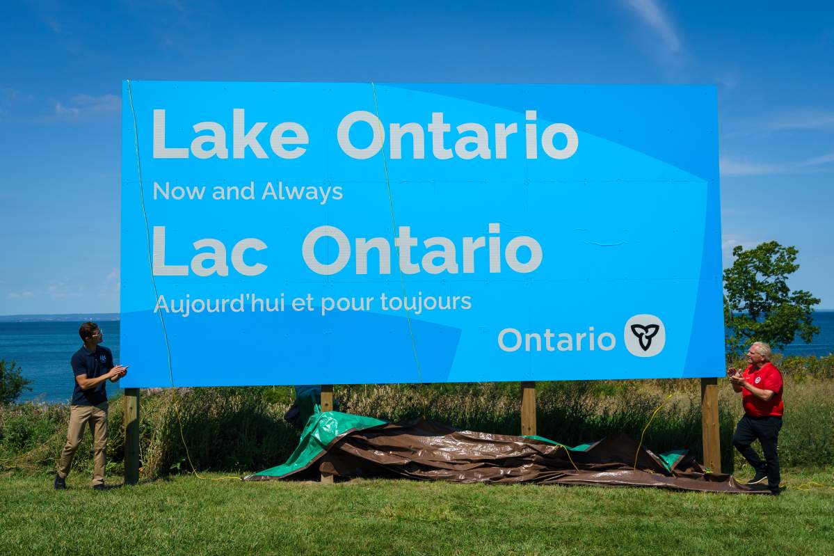 Ontario Premier Doug Ford, right, and Niagara West MPP, Sam Oosterhoff unveil a sign for Lake Ontario at Fifty Point Conservation Area in Grimsby, Ont., on Saturday, Aug. 29, 2026.