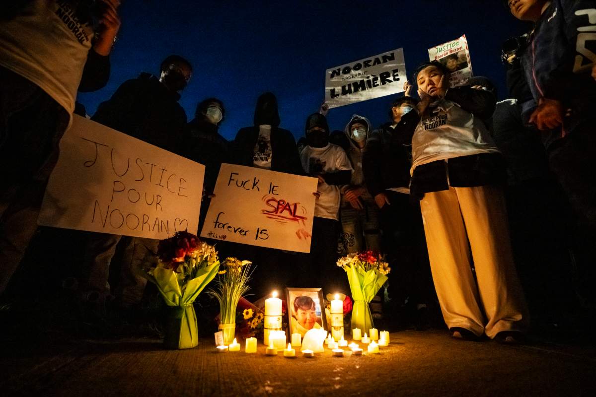 Family, friends and supporters of 15 year-old Nooran Rezayi, who was killed last year by police, take a moment of silence at a vigil held in his honour, in Longueuil, Que., on Monday, Sept. 21, 2026.