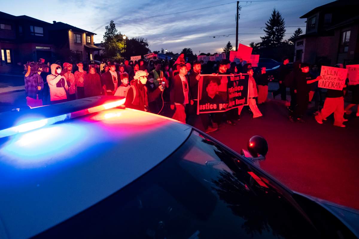 Family, friends and supporters of 15 year-old Nooran Rezayi march from a Service de Police de l’Agglomération de Longueuil station to the site where he was killed by police, during a protest and vigil held in his honour, in Longueuil, Que., on Monday, Sept. 21, 2026.