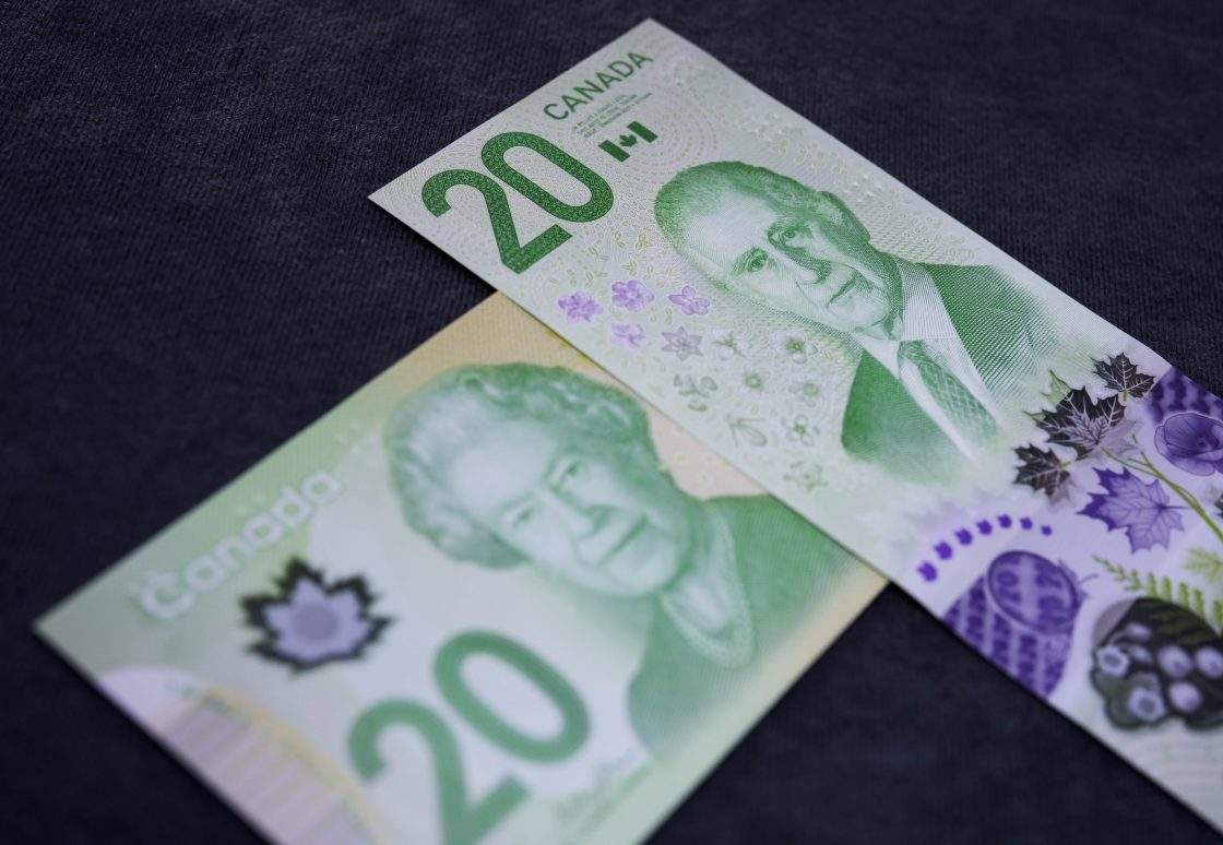 FILE - The portrait of King Charles III is seen on the new Canadian $20 note, alongside a bank note featuring Queen Elizabeth II, at its unveiling event in Ottawa, on Thursday, Sept. 3, 2026.