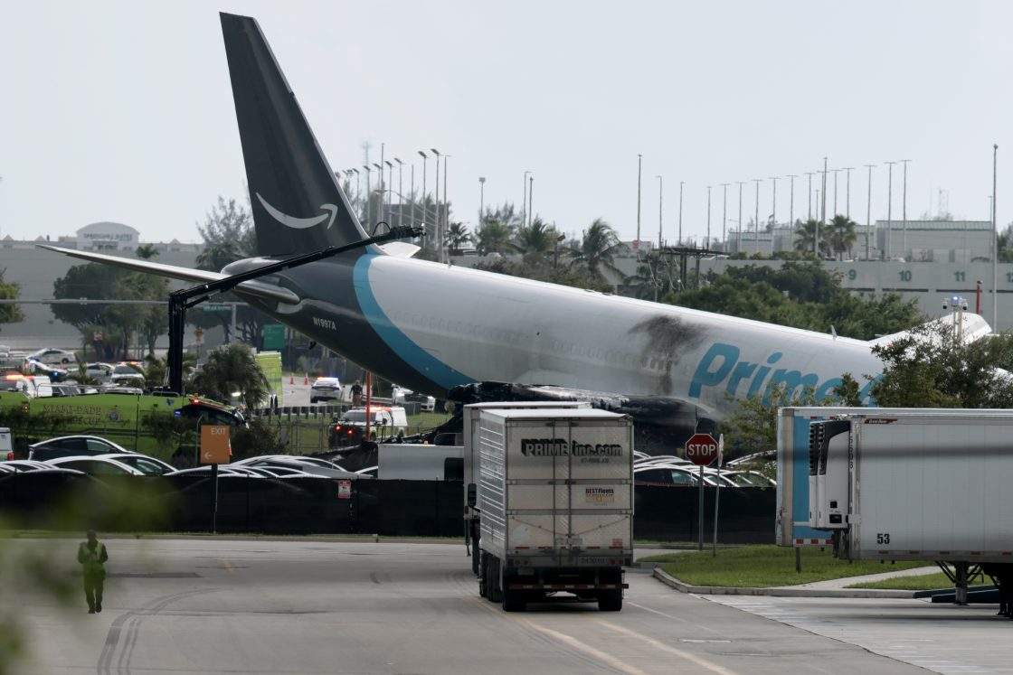 MIAMI, FLORIDA - SEPTEMBER 06: An Amazon cargo plane is seen after it crashed at Miami International Airport on September 06, 2026 in Miami, Florida. In a statement, the Federal Aviation Administration said Prime Air Flight 7598 overran the runway while landing around 2 p.m. after departing from Luis Muñoz Marín International Airport in San Juan, Puerto Rico, earlier today.