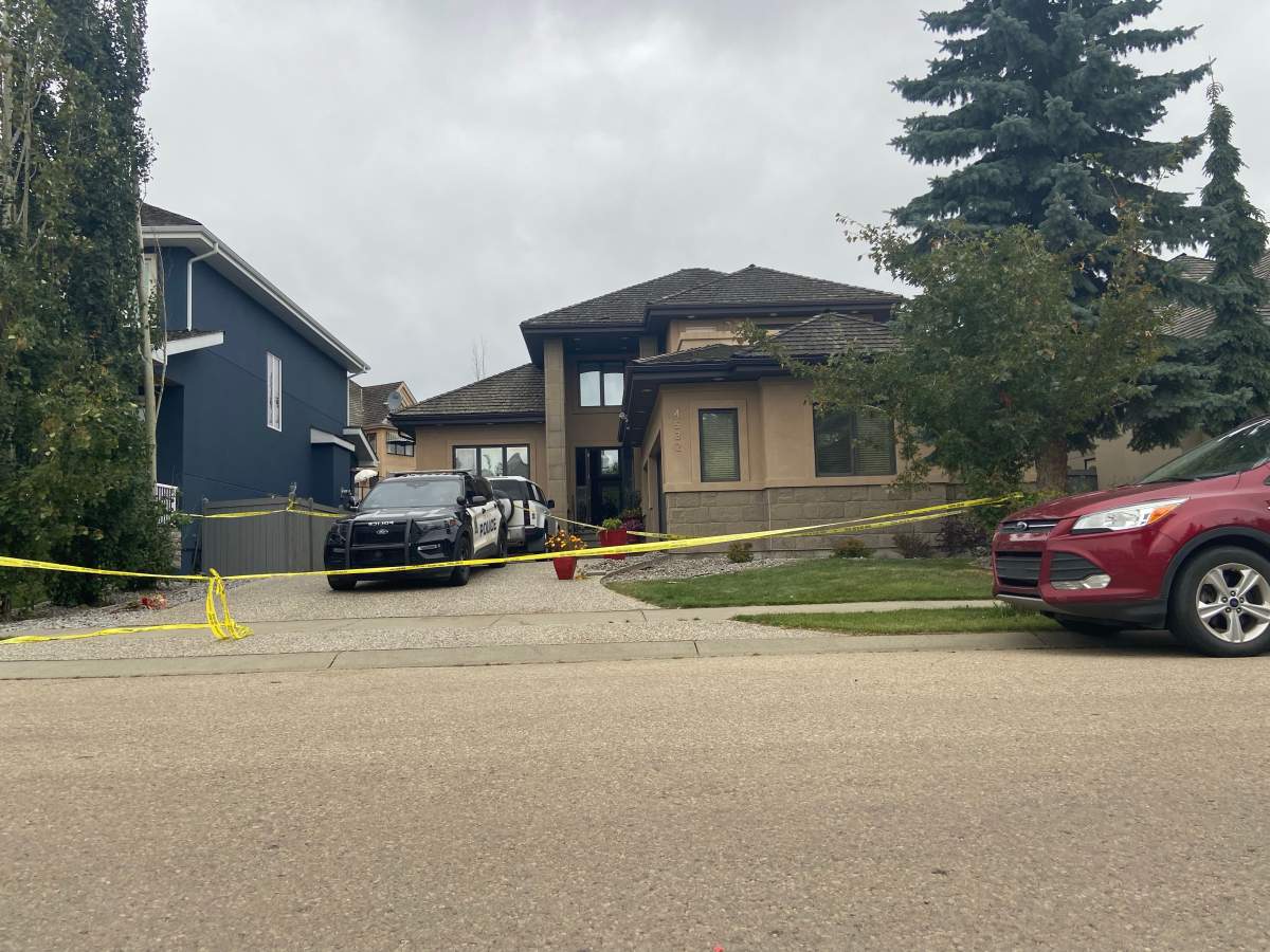 Police tape surrounds a home near Donsdale Drive and 45 Avenue in west Edmonton where officers shot a man at a home where two women and a baby were found injured on Sunday, Sept. 13, 2026.