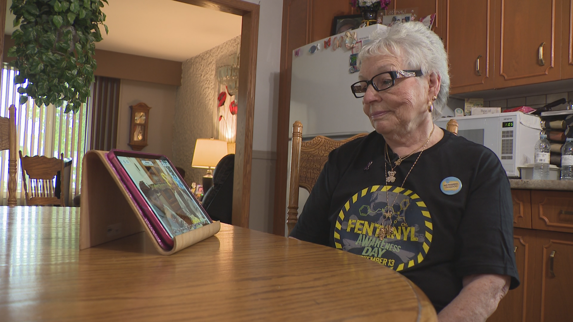 Lorna Reykdal looks at photos of her grandson, Brayden Crotty, who died of an overdose in October 2024.