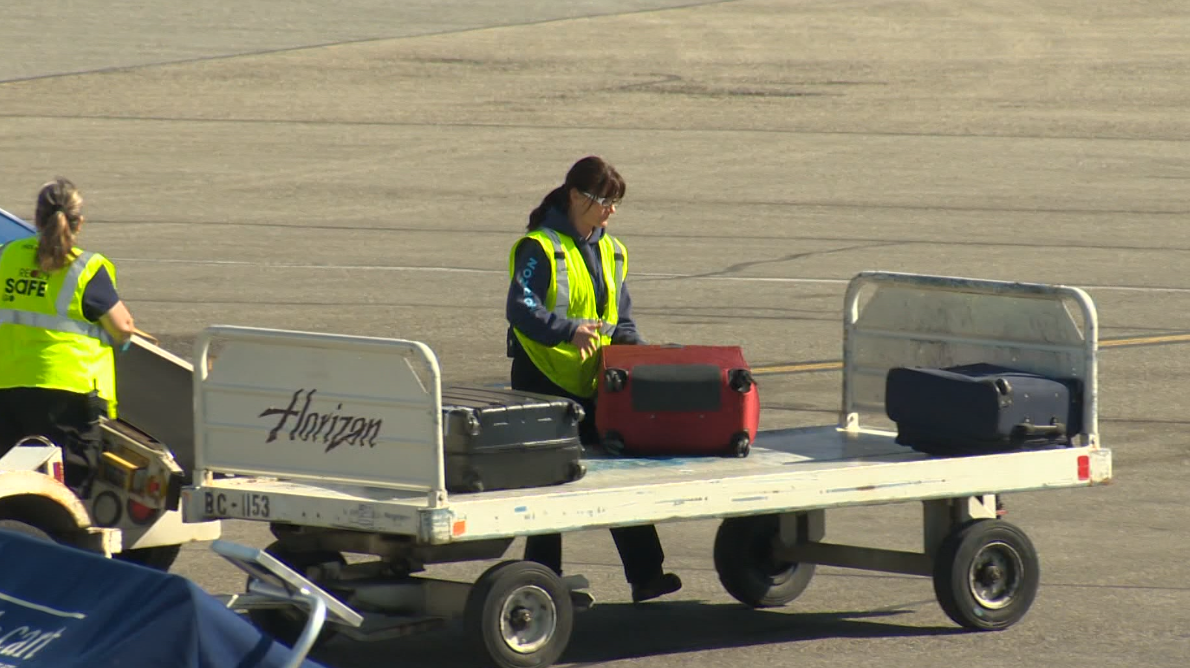 A YLW worker on the tarmac at Kelowna International Airport. An estimated 2,700 additional jobs could be created by the expansion.
