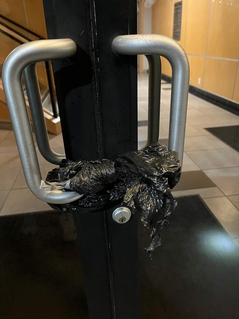The plastic bag someone tied on an office door on Commerce Ave. in Kelowna temporarily locking in the people inside.