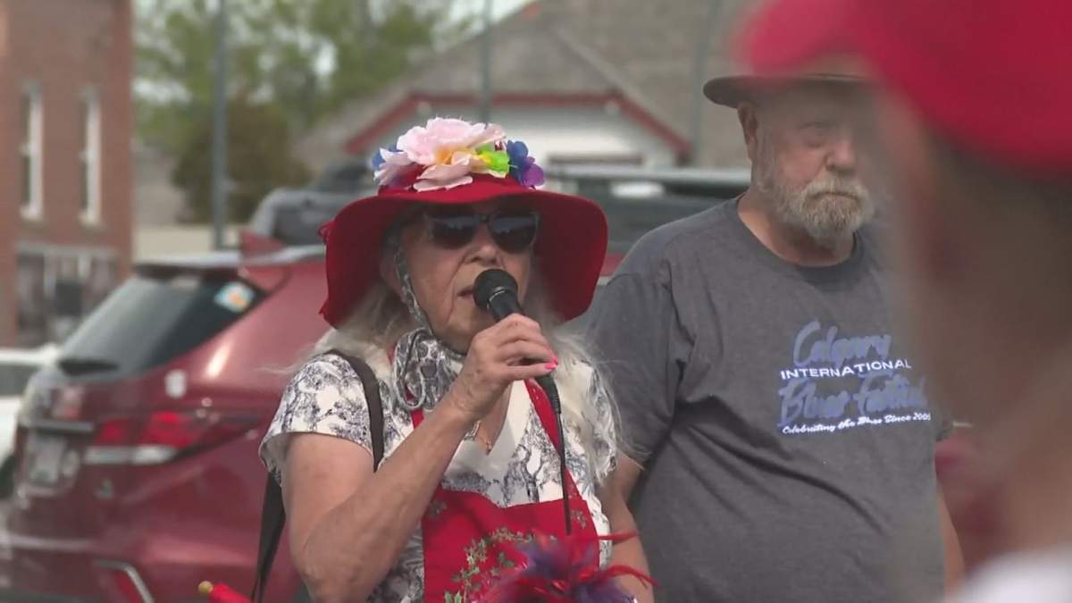 Protestor and Lethbridge Friends of Medicare Chair Bev Muendel-Atherstone speaking.