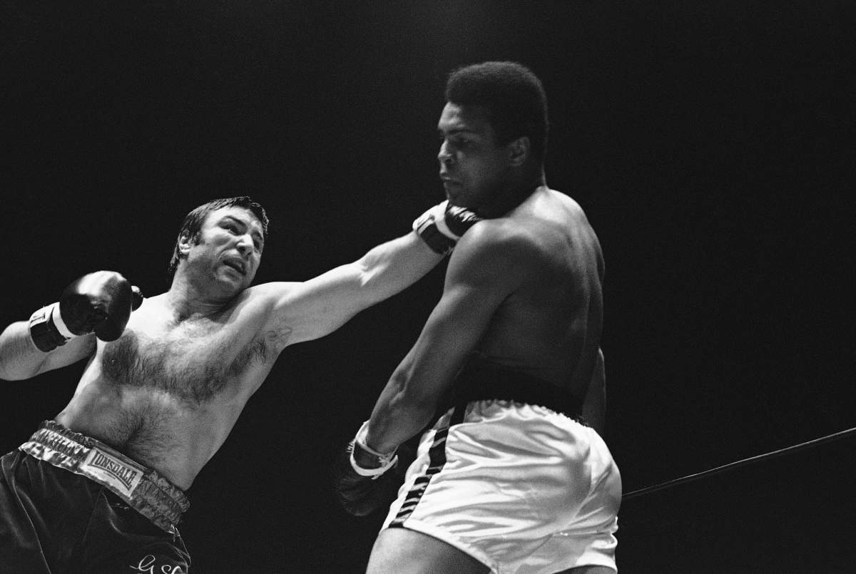 FILE – In this May 1, 1972, file photo, George Chuvalo connects with a left to the head of Muhammad Ali in the first round of their scheduled 12-round fight in Vancouver. (AP Photo/File)