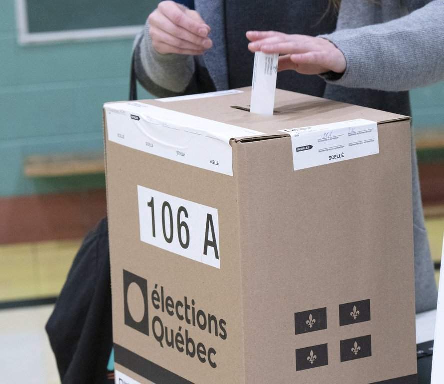 A voter casts their ballot in the Quebec provincial election, Monday, Oct. 3, 2022 in Montreal. 
