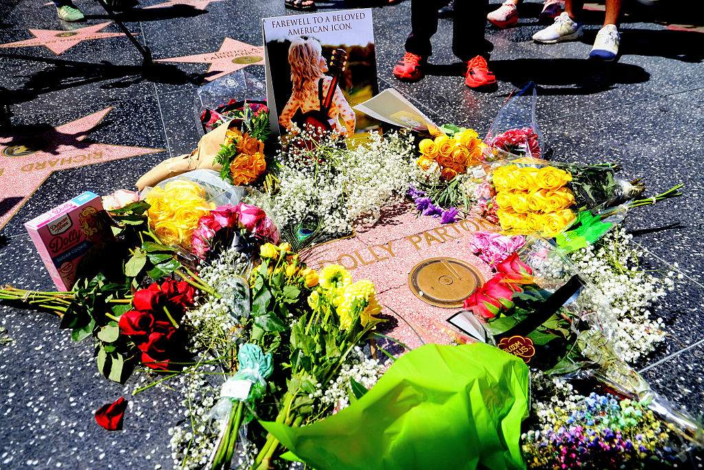 Flowers are laid on Dolly Parton's star on The Hollywood Walk of Fame on August 25, 2026 in Los Angeles, California.
