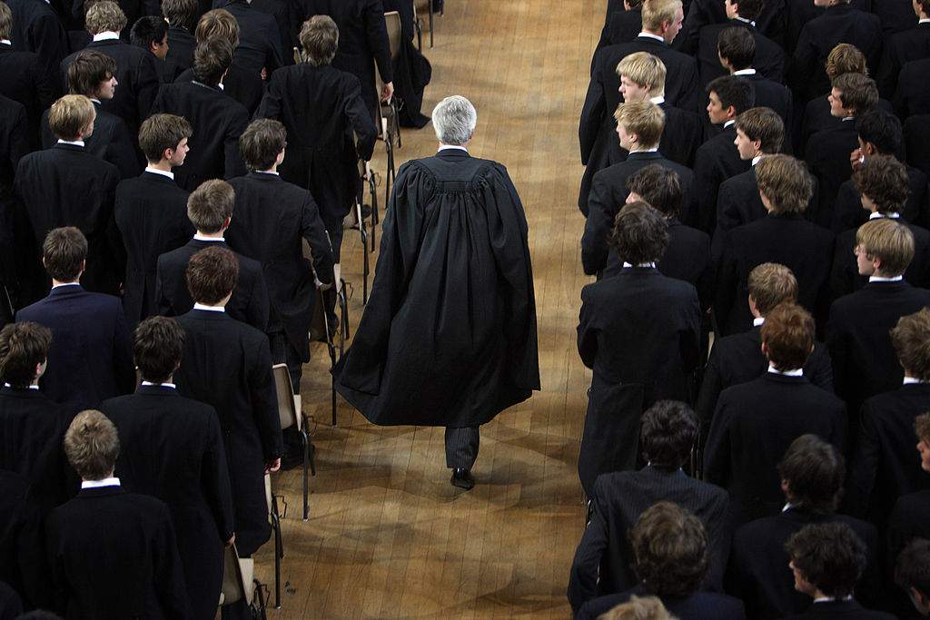 FILE: The boys of Eton College stand as headmaster Tony Little arrives for morning assembly on September 6, 2007 in Eton, England. An icon amongst private schools, since its founding in 1440 by King Henry VI, Eton has educated 18 British Prime Ministers, as well as prominent authors, artists and members of royal families from around the world. The school caters for some 1300 pupils divided into 25 houses each one overseen by a housemaster chosen from the senior ranks of the staff which number around 160.