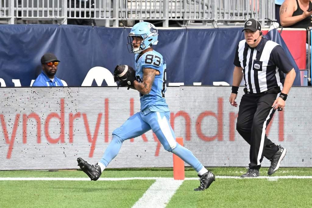 Toronto Argos wide receiver David Ungerer (83) scores a touchdown against the Ottawa Redblacks during second half CFL football action in Toronto on Saturday, Sept. 12, 2026. THE CANADIAN PRESS/Jon Blacker.