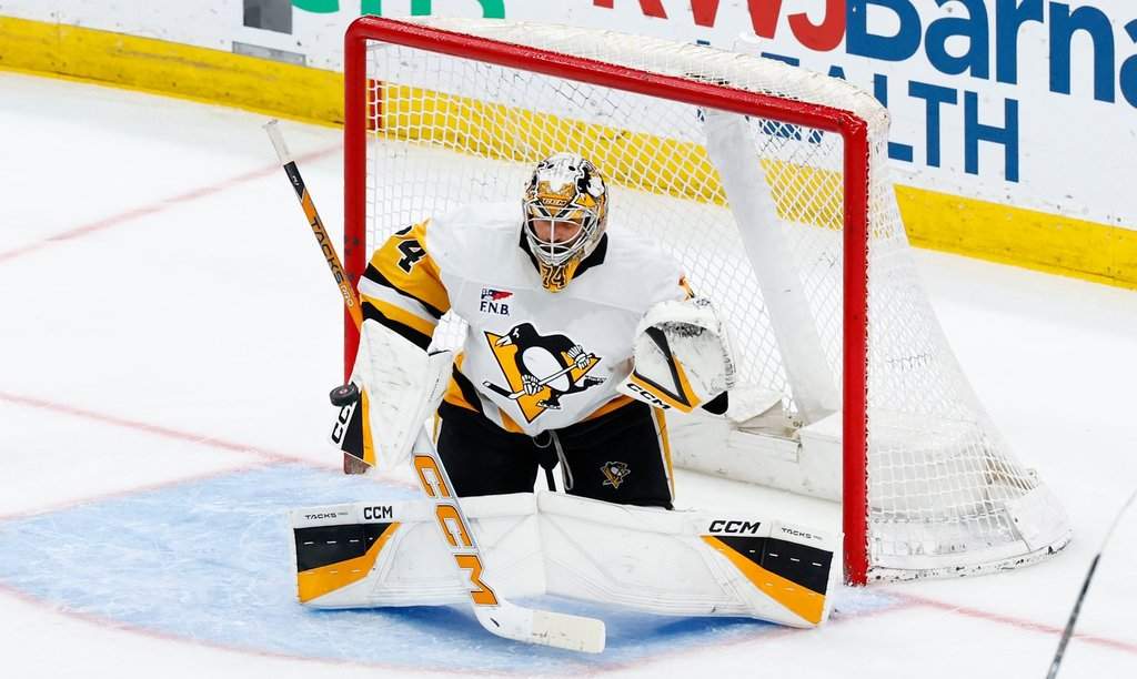 Pittsburgh Penguins goaltender Stuart Skinner makes a save against the New Jersey Devils during the third period of an NHL game on April 9, 2026, in Newark, N.J. (AP Photo/Noah K. Murray).
