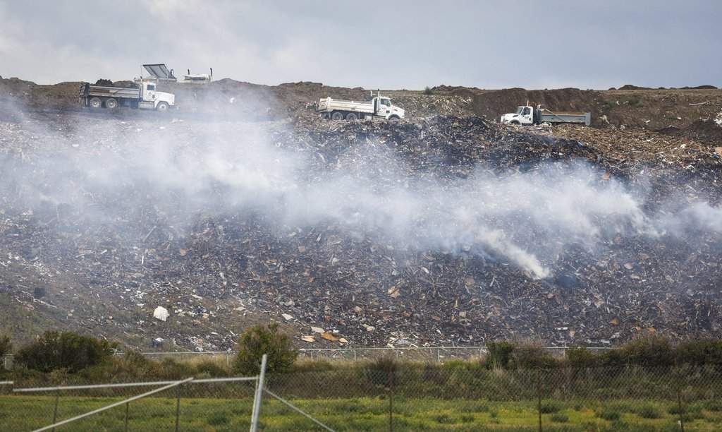Smoke rises from a smouldering landfill fire at the ECCO Recycling landfill in southeast Calgary, Monday, Sept. 14, 2026.THE CANADIAN PRESS/Jeff McIntosh.