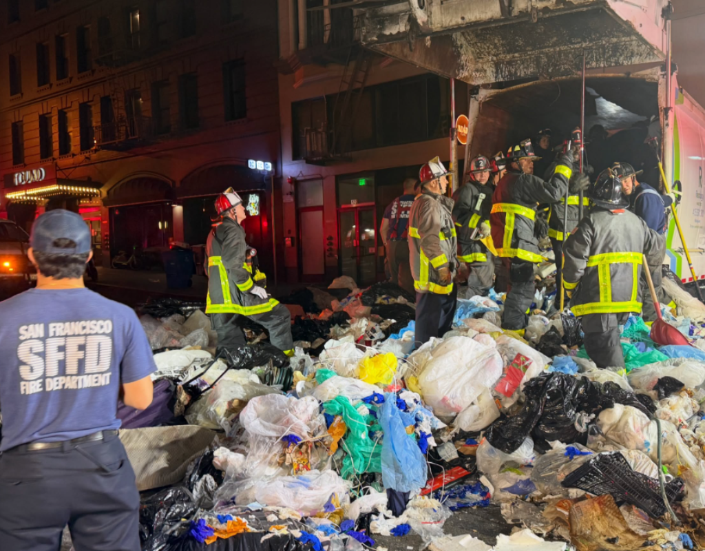 San Francisco firefighters and paramedics rescue a man who became trapped in a garbage truck.