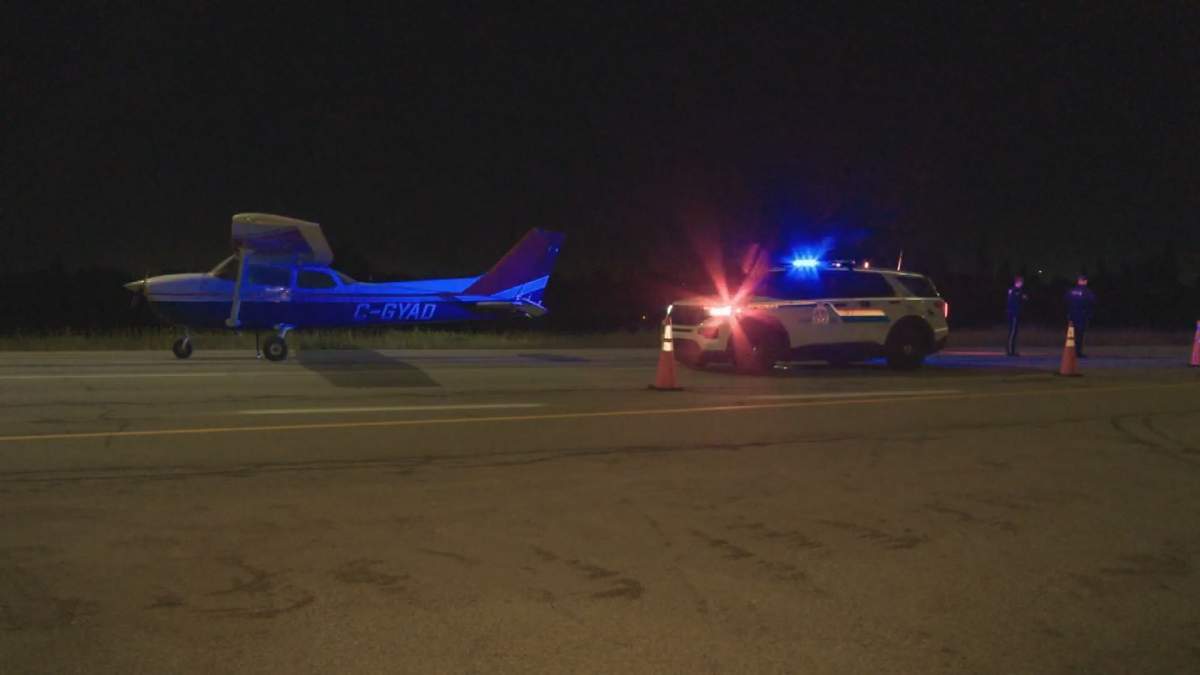 A small CESSNA 172 plane sits on Highway 21 east of Edmonton on Sept. 16 after making an emergency landing.