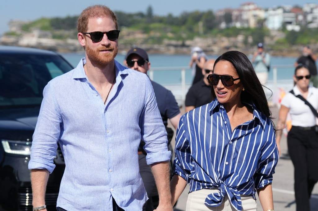 Prince Harry, and Meghan, the Duke and Duchess of Sussex, arrive to meet volunteer first responders from Bondi Surf Bathers' Life Saving Club, during a visit to Bondi Beach, Australia, Friday, April 17, 2026.