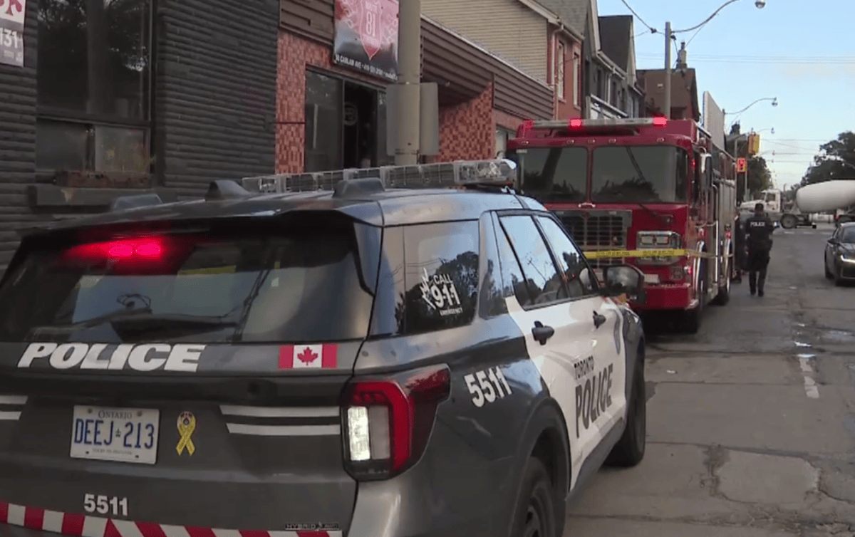 Police and firefighters on the scene of a blaze at Carlaw Ave. and Eastern Ave.