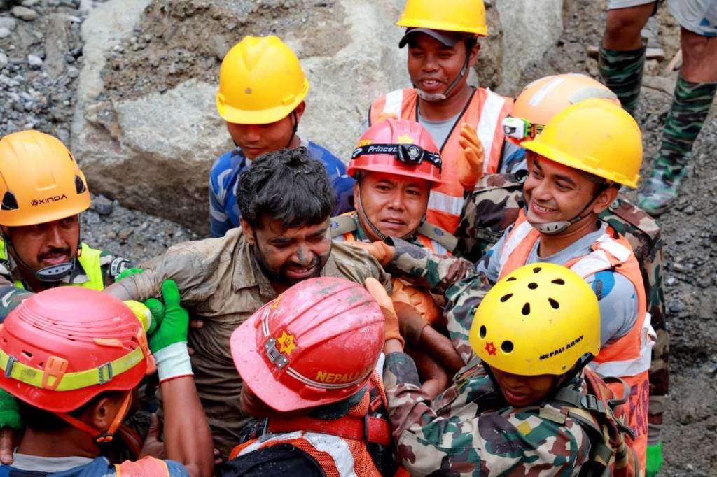 Rescuers transfer a worker rescued alive in Rasuwa district, Nepal, September 4, 2026. Two men trapped inside the tunnel of the Trishuli 3A hydropower project, which was badly affected by last week's deadly mudslide, were rescued alive on Friday, the Nepali Army said.