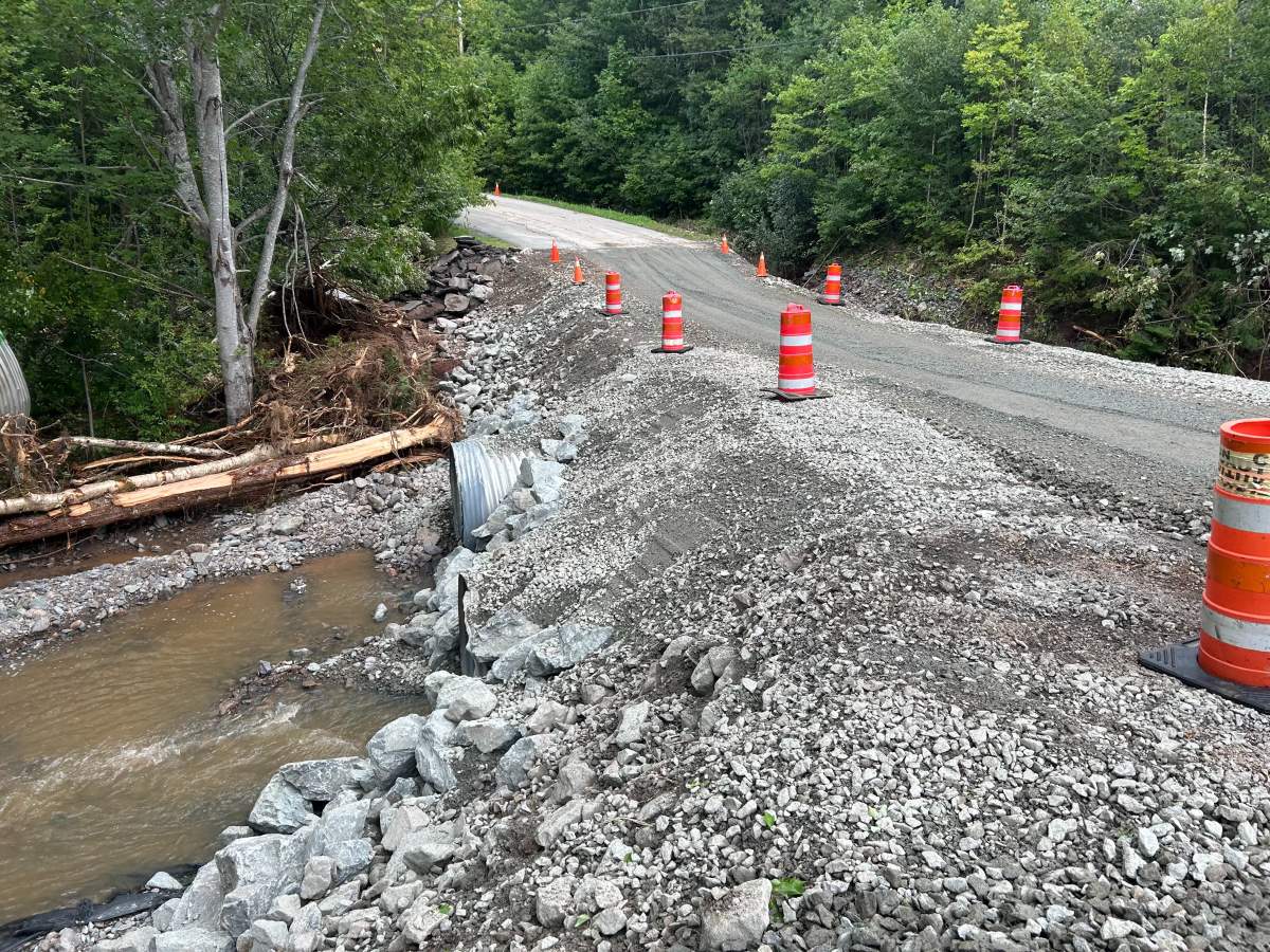 Pylons section off the sides of a newly rebuilt section of West Bay Road after it was washed out this weekend in Richmond County, N.S.