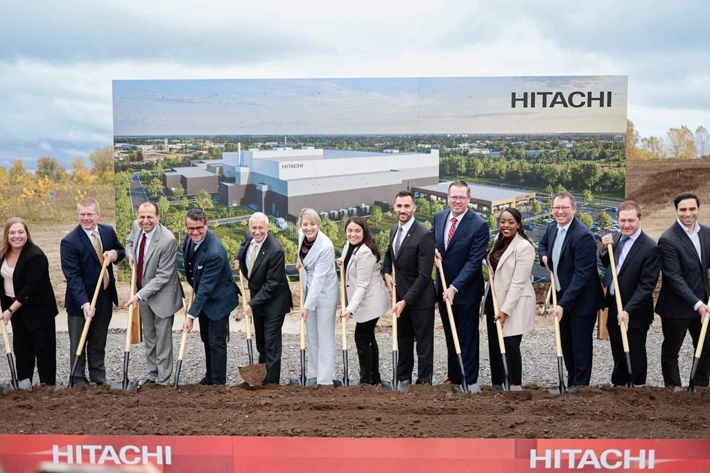 Industry Minister Melanie Joly, sixth from left, and Ontario Energy Minister Stephen Lecce, sixth from right, join Hitachi Energy executives to break ground on a new $479-million transformer insulation factory in London, Ont., in a Friday, Oct. 16, 2026, handout photo. THE CANADIAN PRESS/Handout — Hitachi Energy Canada (Mandatory Credit).