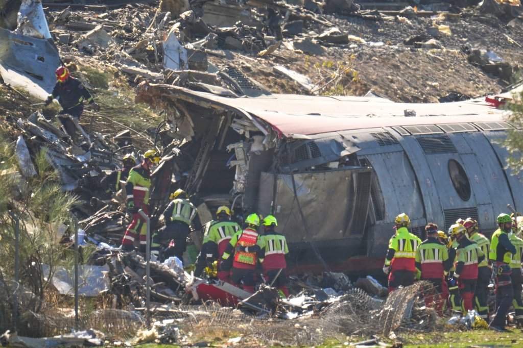 Emergency services work at the scene of a collision between two trains in Urda, Spain, Wednesday, Oct. 28, 2026.