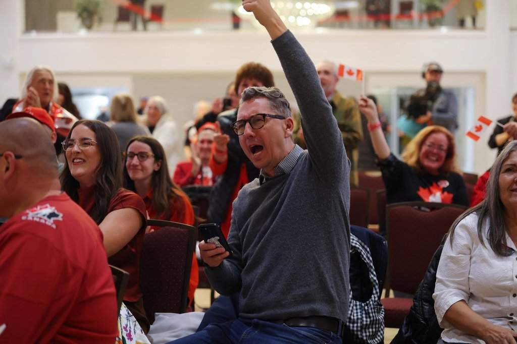 Supporters cheer as results begin to display at the pro Canada watch party in Edmonton, Monday, Oct. 19, 2026.