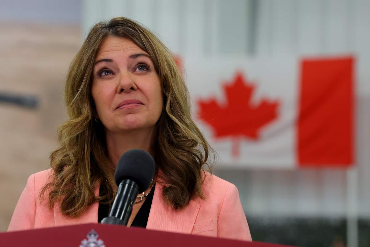 Alberta Premier Danielle Smith listens to a question during a press conference at the Canadian Forces Base in Edmonton on Wednesday, Oct. 7, 2026.