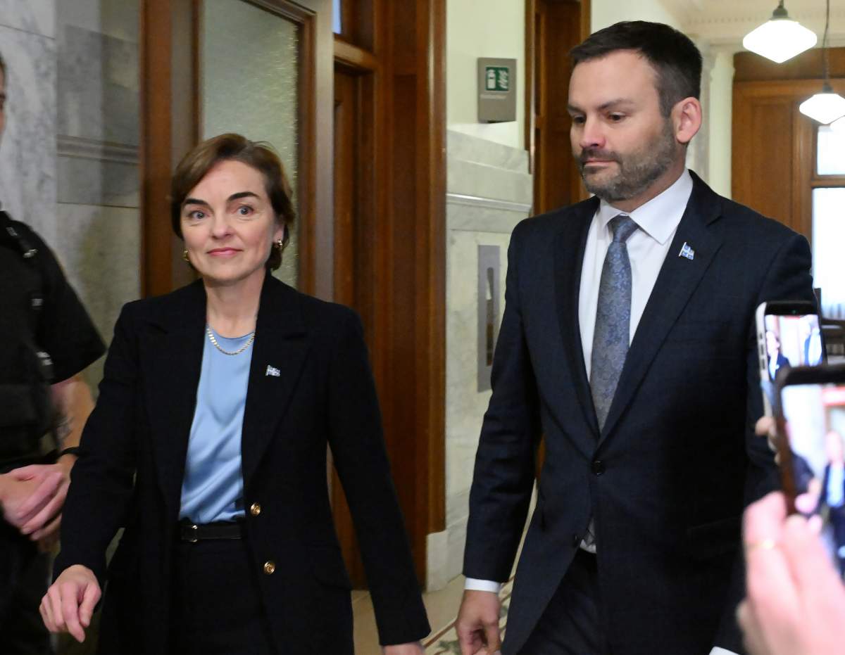 Quebec Premier Christine Frechette, left, walks with premier-designate Paul St-Pierre Plamondon after a transition meeting at the premier’s office in Quebec City, on Tuesday, Oct. 13, 2026.