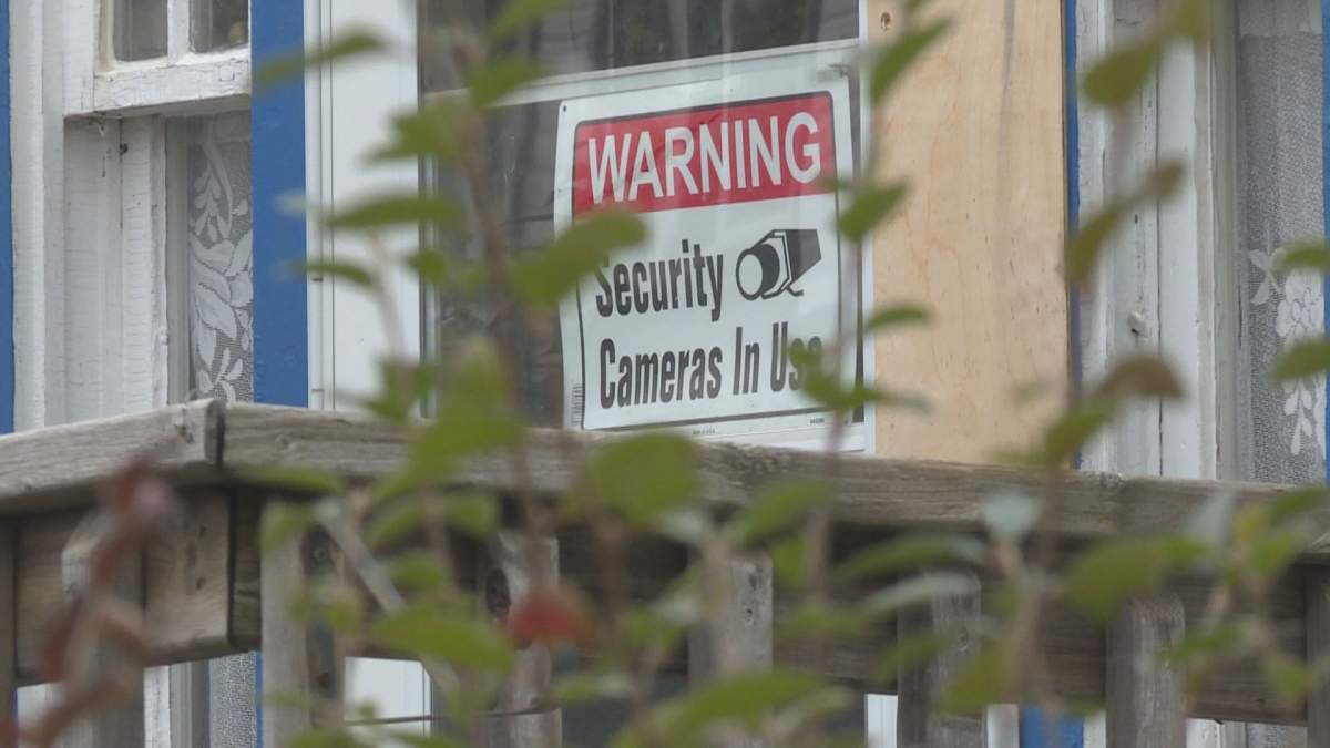A security camera sign hangs on a home in the William Whyte neighbourhood.