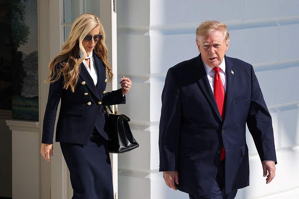 White House Press Secretary Katie Zacharia (L) joins U.S. President Donald Trump as he departs on the South Lawn of the White House on October 13, 2026 in Washington, DC.
