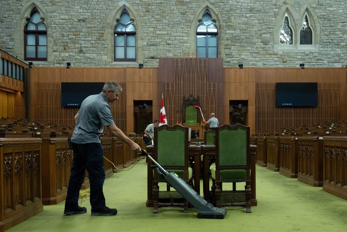 A House of Commons maintenance and material handling employee vacuums the carpet in the House of Commons during a photo op in Ottawa, Thursday, Sept. 17, 2026. THE CANADIAN PRESS/Adrian Wyld