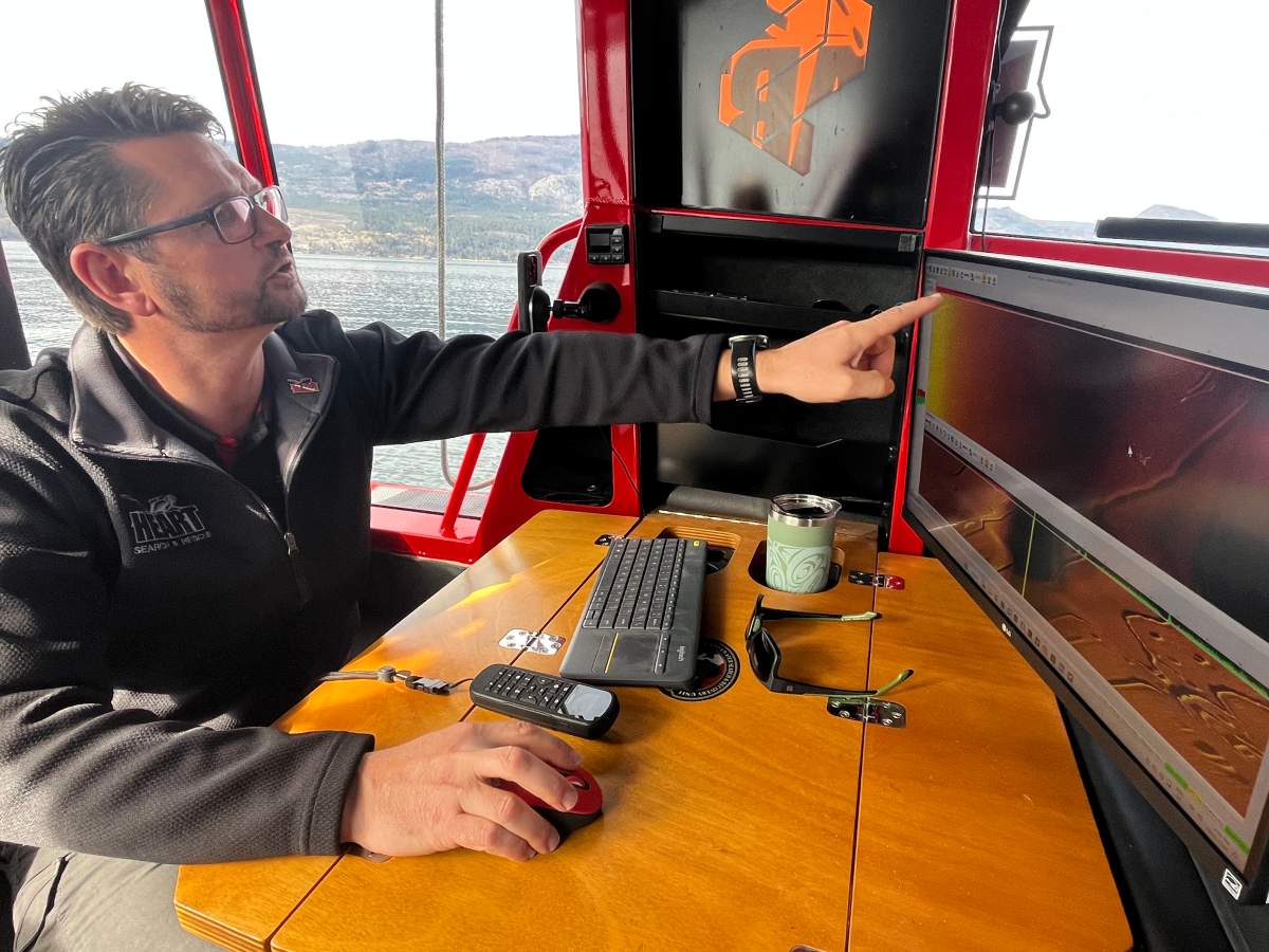 Manuel Maendel points out an anomaly on the sonar screen. It could be something, but without a visual confirmation, there’s no way to know for sure what’s beneath the surface.